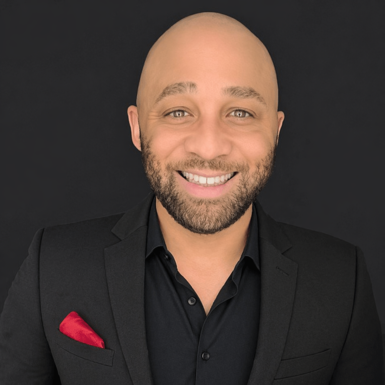 Louis Reed speaking on stage